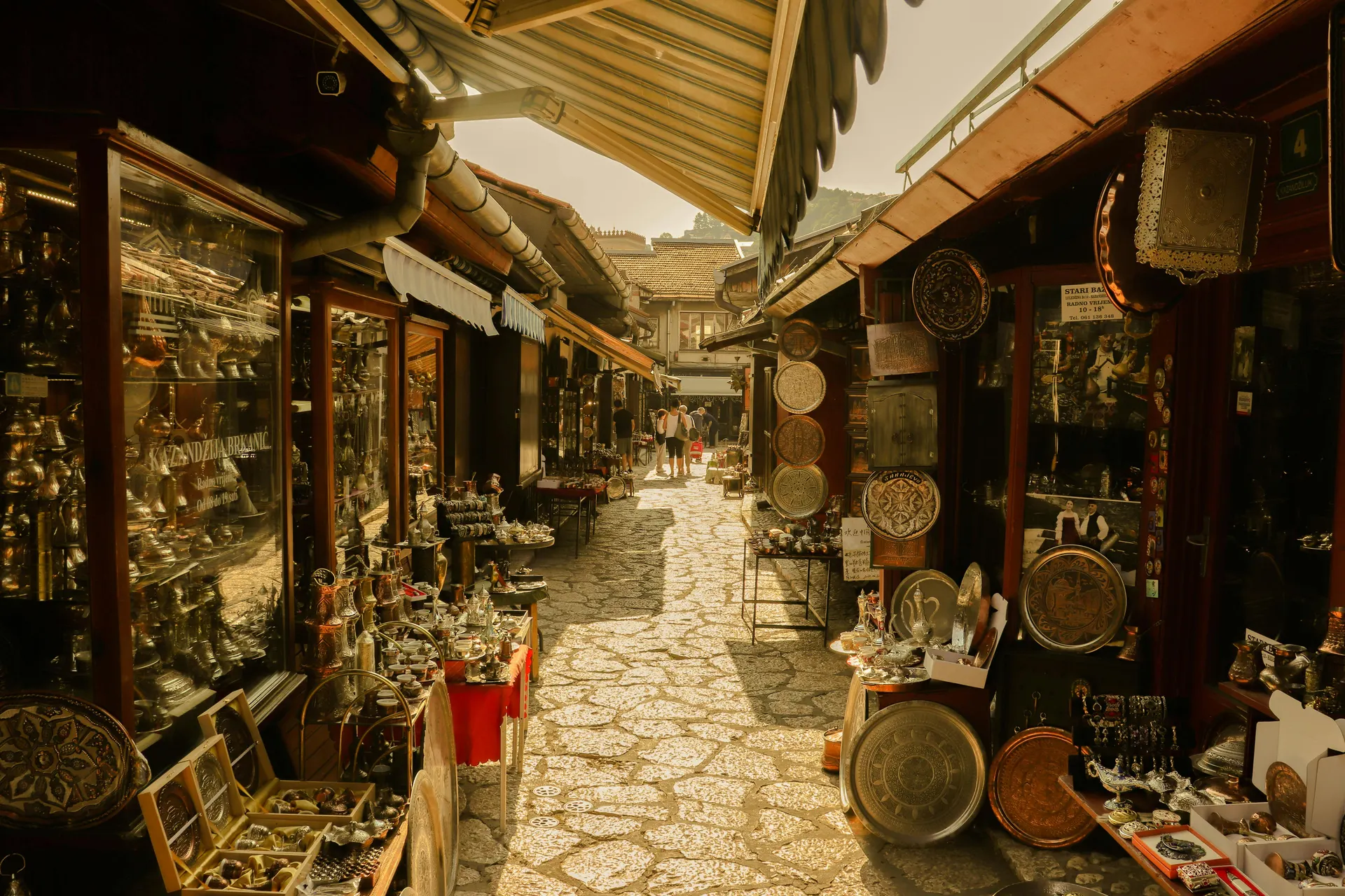 Traveller exploring a calm historic market street with colourful local details