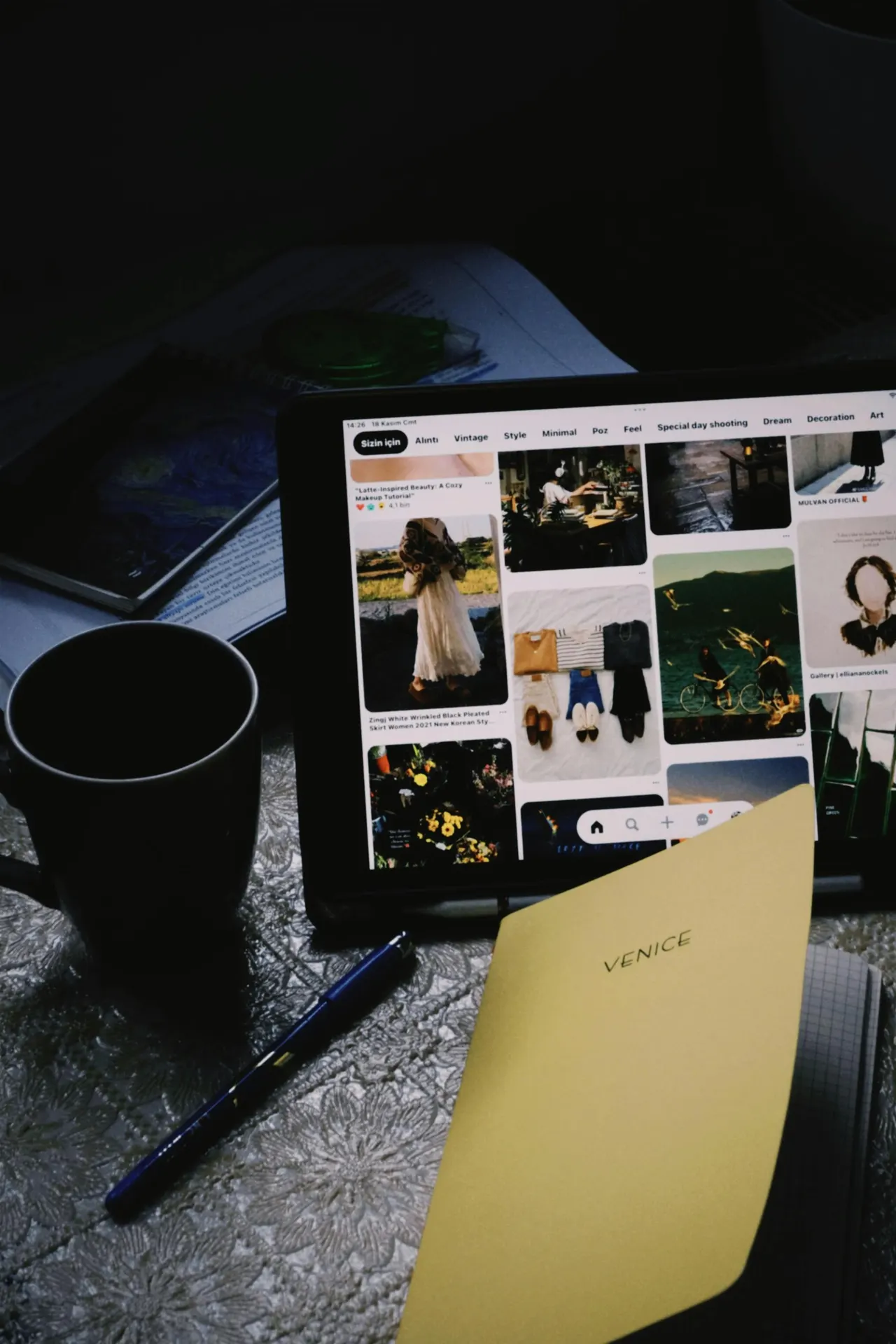 Travel journal, route map and warm window light on an editorial planning desk