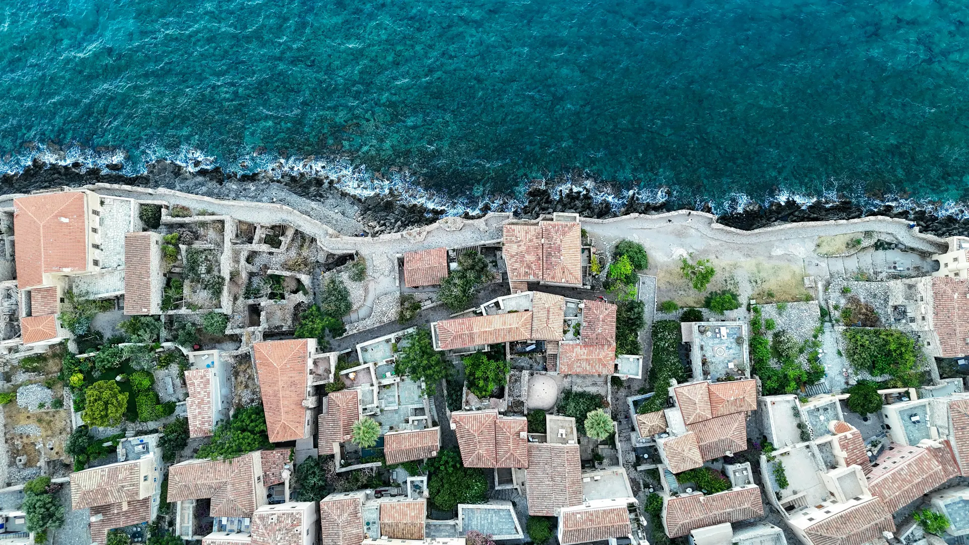 Warm coastal old town with azure water and sunlit architecture for worldwide travel